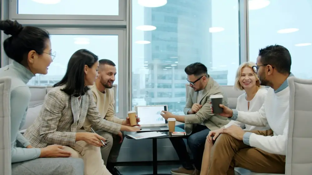 Diverse group of people in a modern office meeting, illustrating leadership development and team resilience